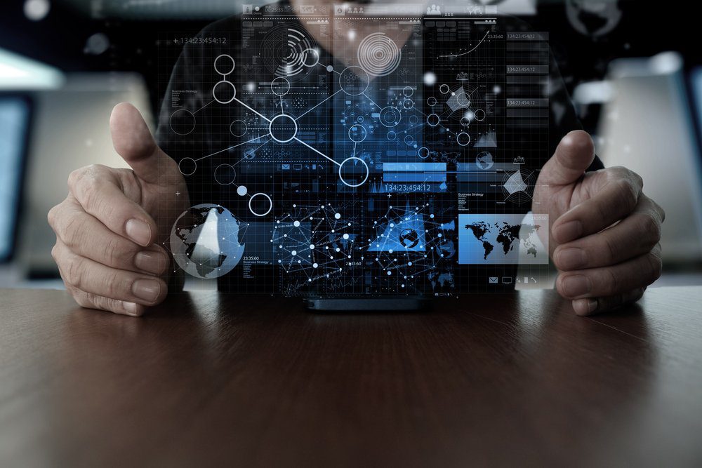 office-graphic-overlay hands on desk with analytics graphic overlayed