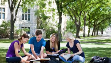 college students sitting in circle studying outside