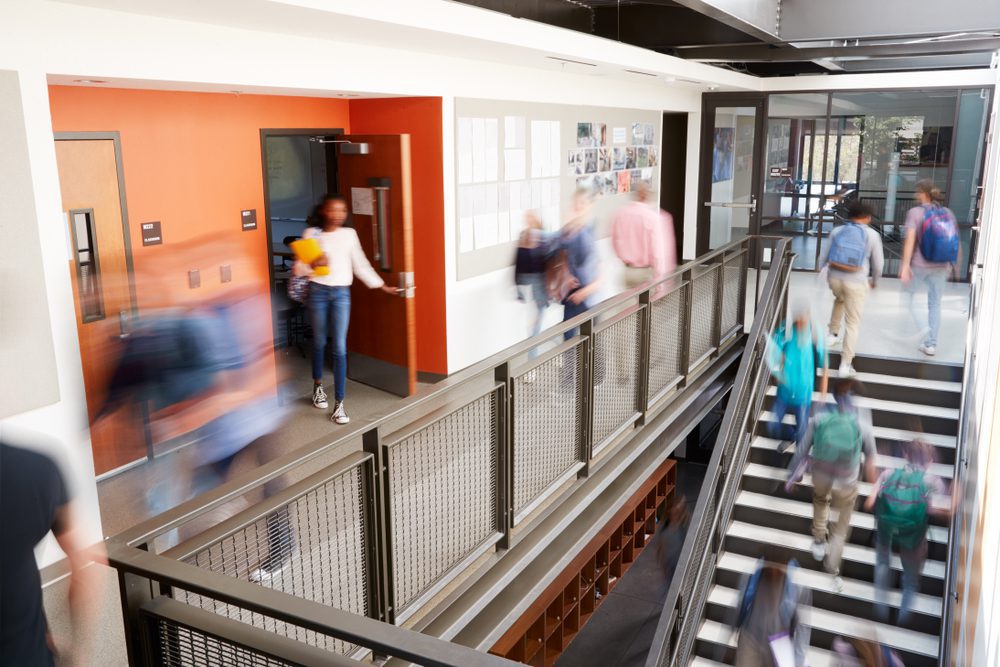 Busy High School Corridor During Recess With Blurred Students Busy High School Corridor During Recess With Blurred Students
