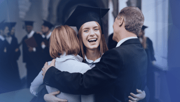 college graduation family hugging