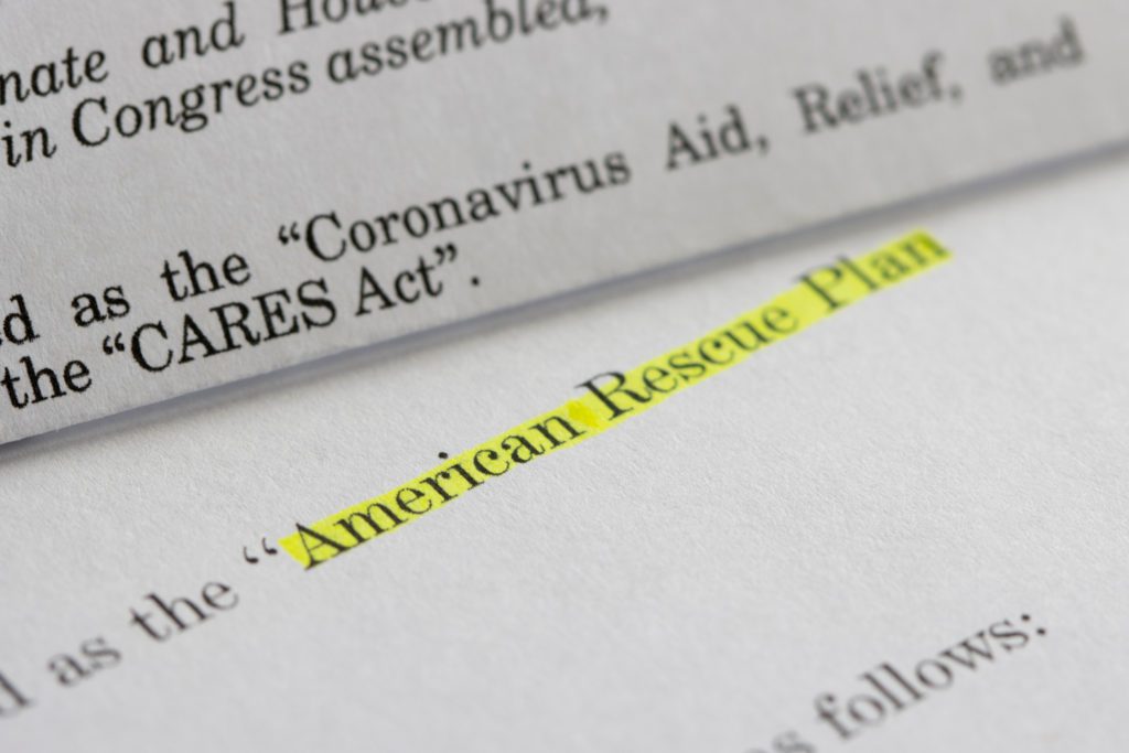 American Rescue Plan text highlighted on a piece of paper