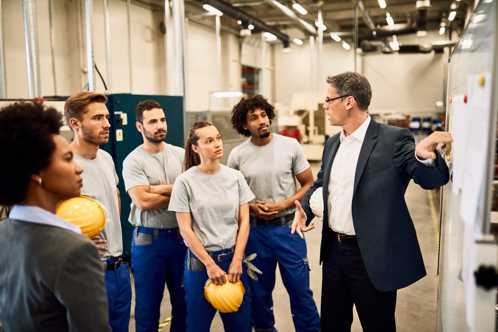 employees in a group at a safety meeting