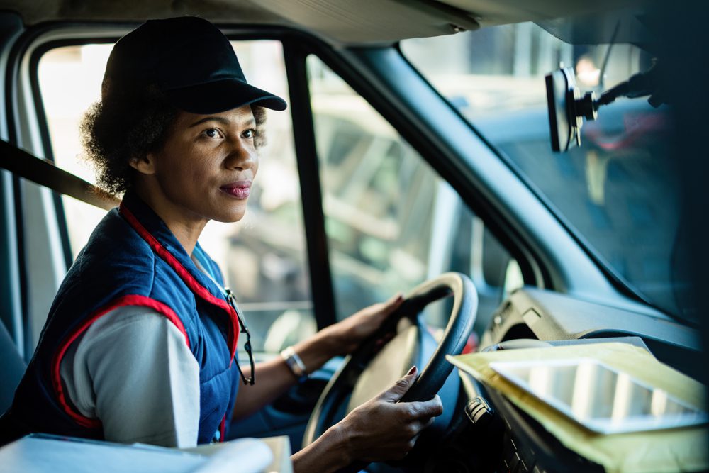 lone worker woman driving transportation delivery truck